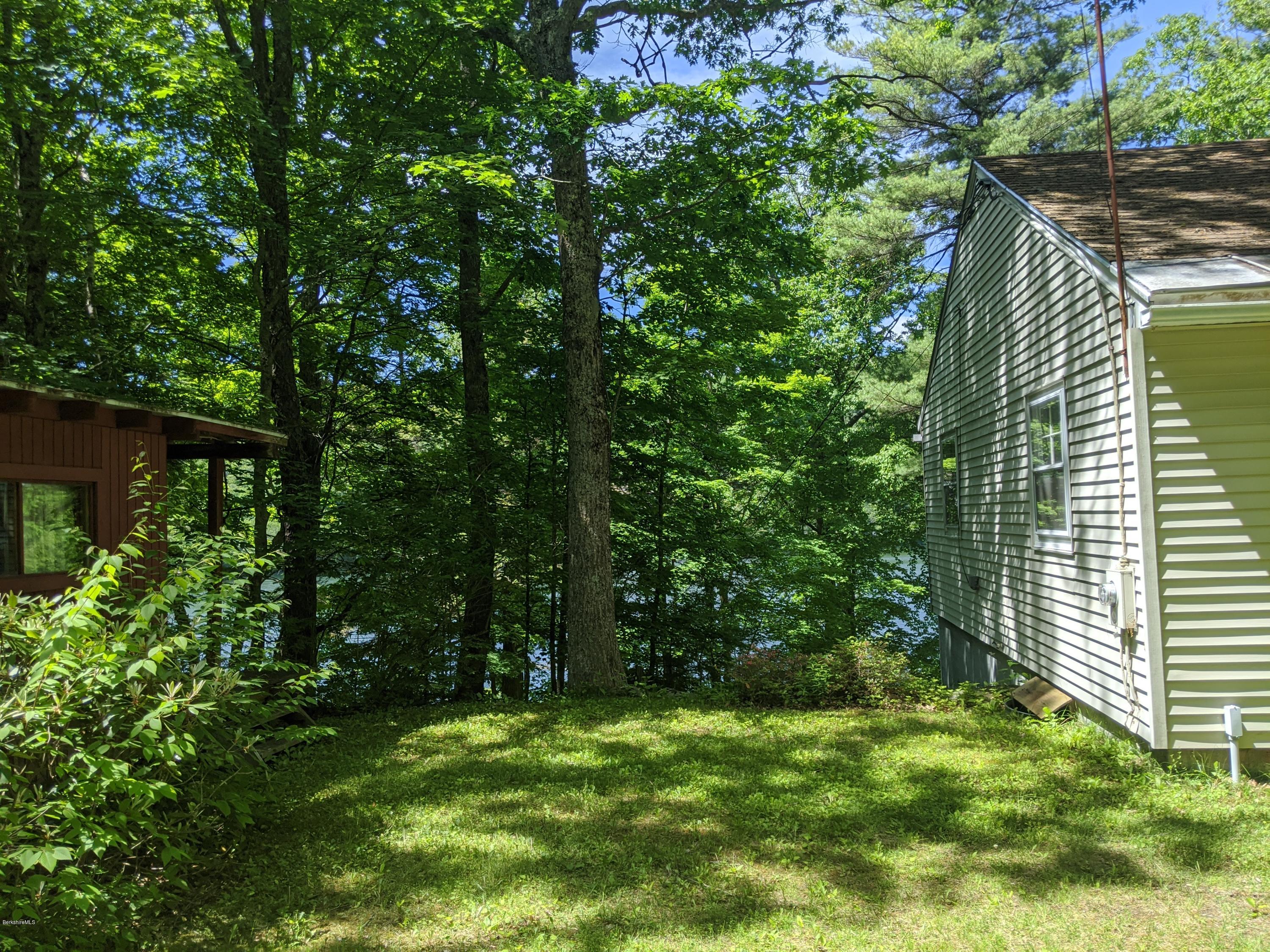 3626 Jacobs Ladder Road Becket, MA 01223 - Photo 9 of 56 a backyard of a house with lots of green space
