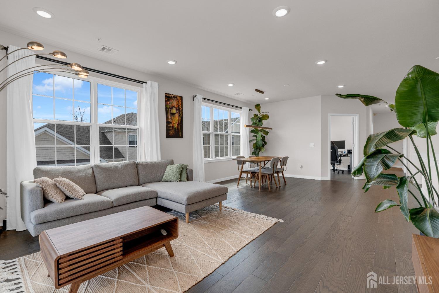 237 Lorhan Drive, Unit 237 Piscataway, NJ 08854 - Photo 12 of 44 a living room with furniture and a large window
