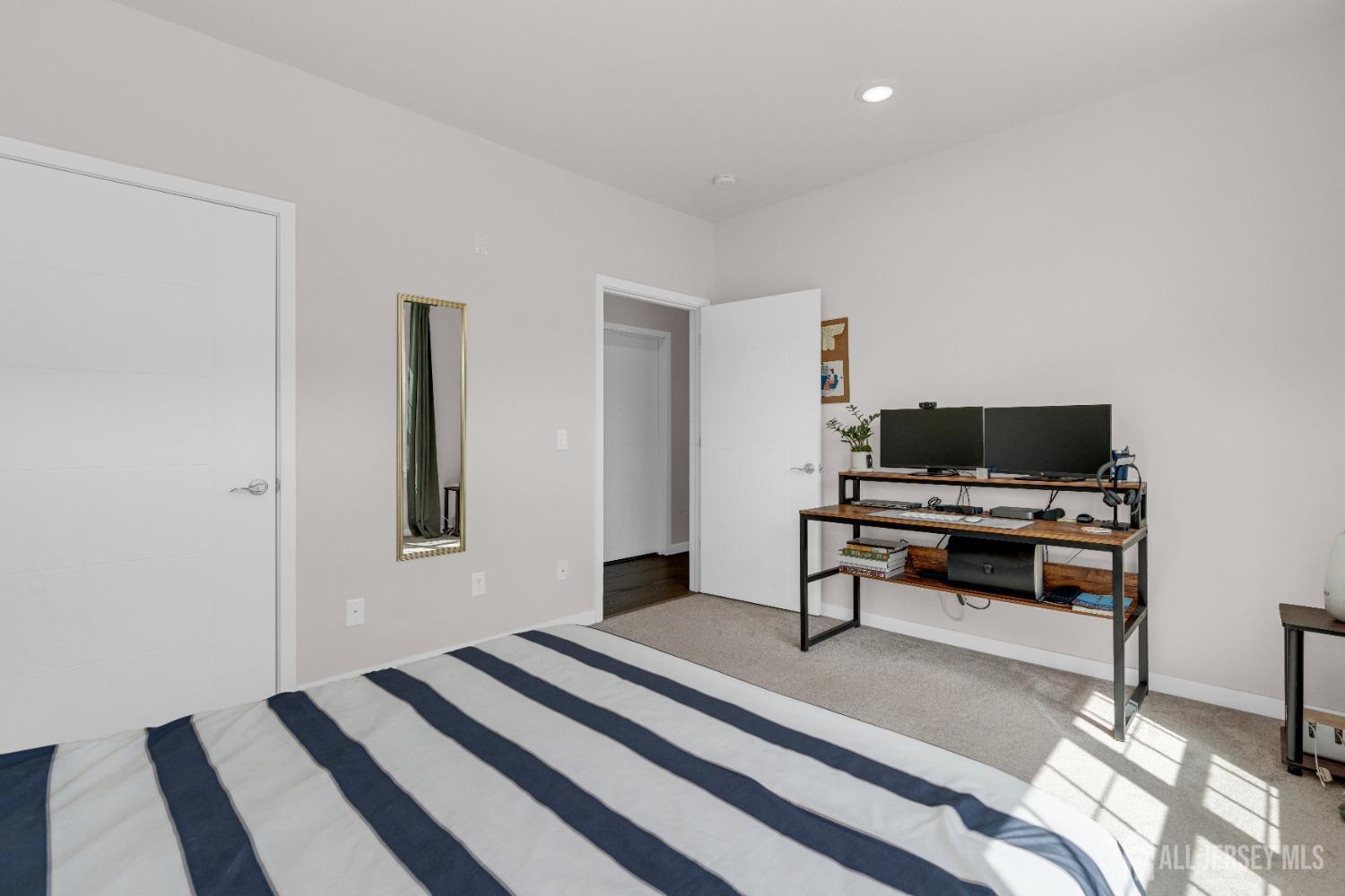 237 Lorhan Drive, Unit 237 Piscataway, NJ 08854 - Photo 21 of 44 a living room with furniture and a flat screen tv