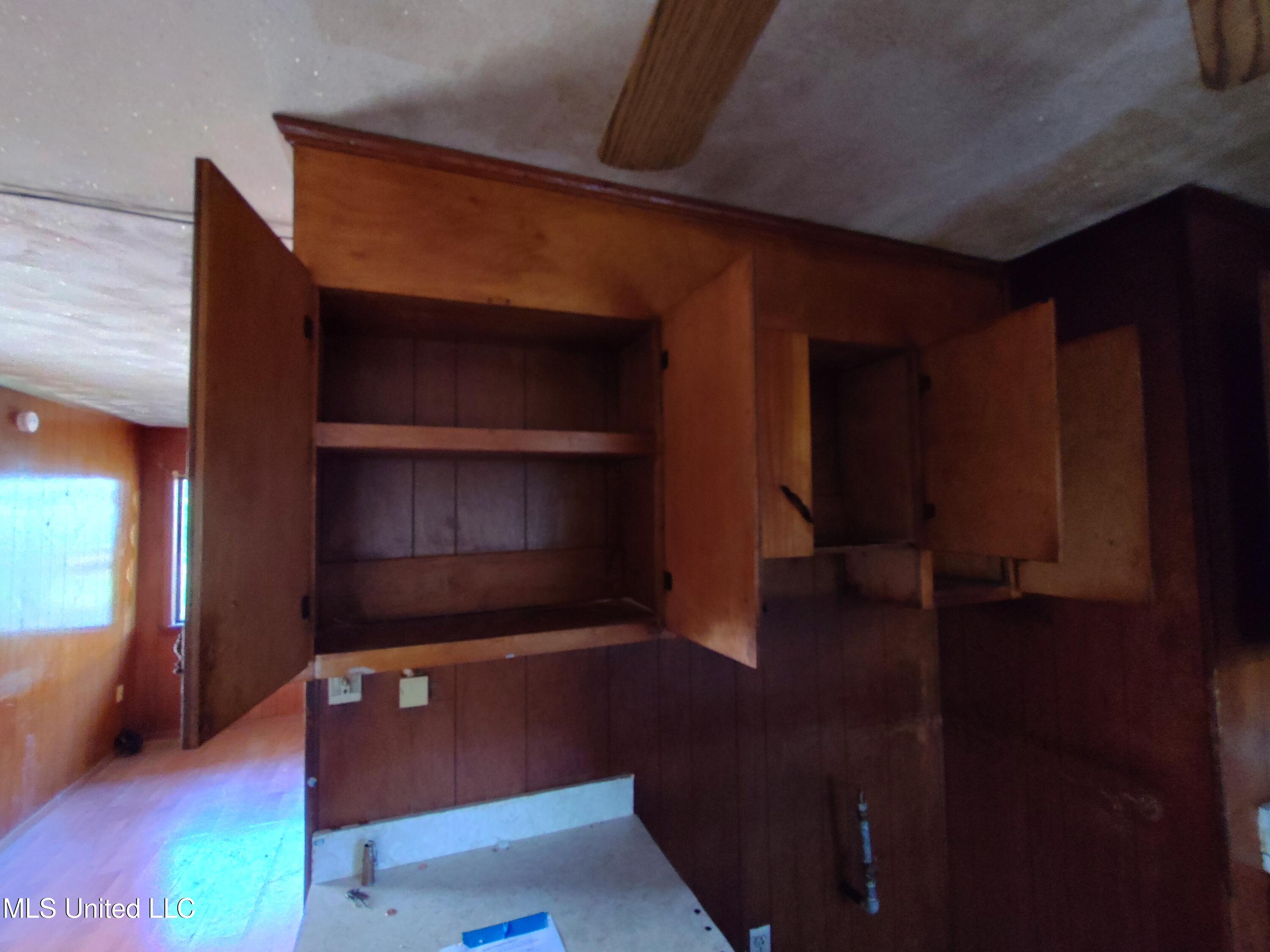 110 Claiborne Street Port Gibson, MS 39150 - Photo 14 of 24 110 Claiborne kitchen cabinets