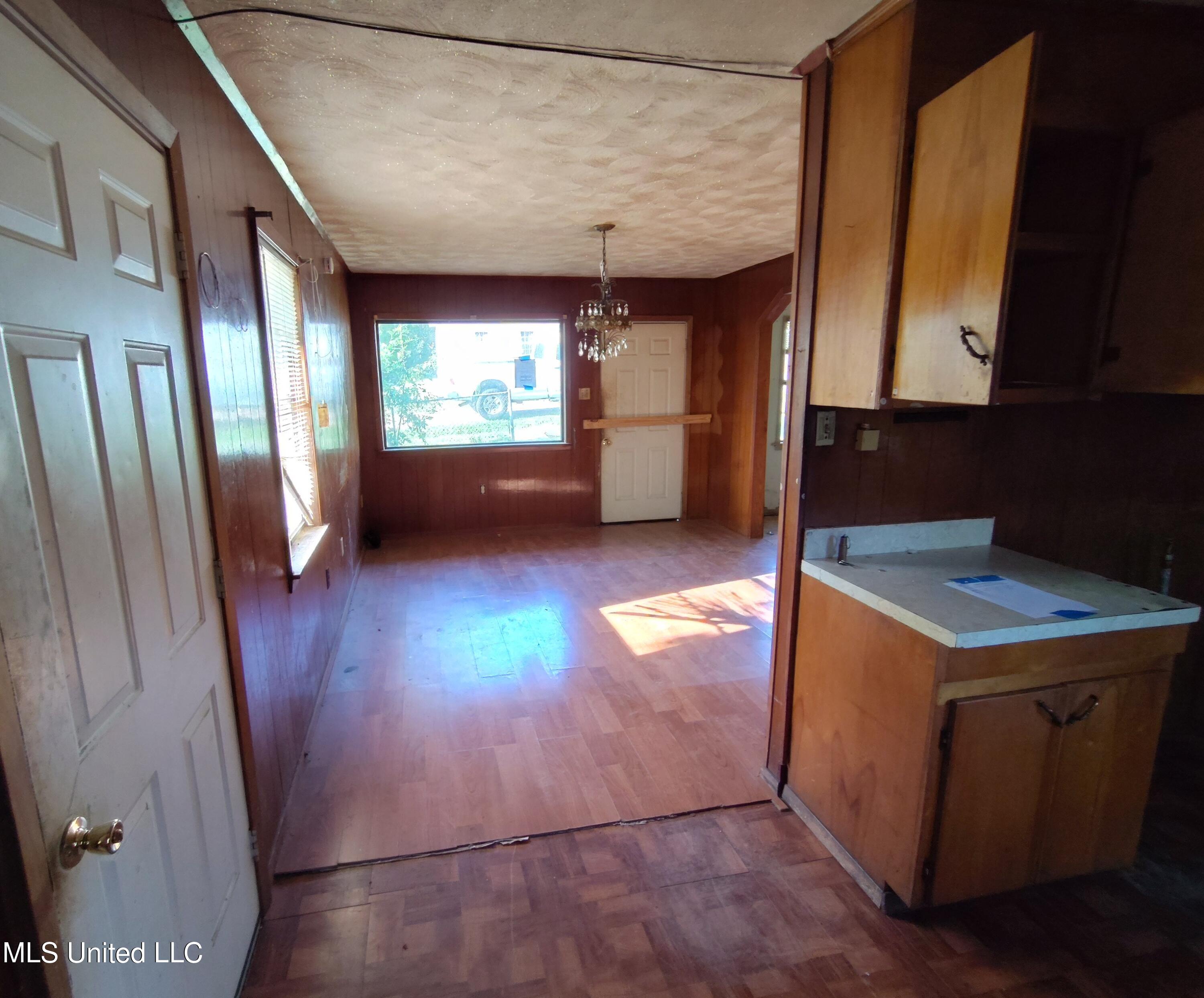 110 Claiborne Street Port Gibson, MS 39150 - Photo 9 of 24 110 Claiborne kitchen to living area