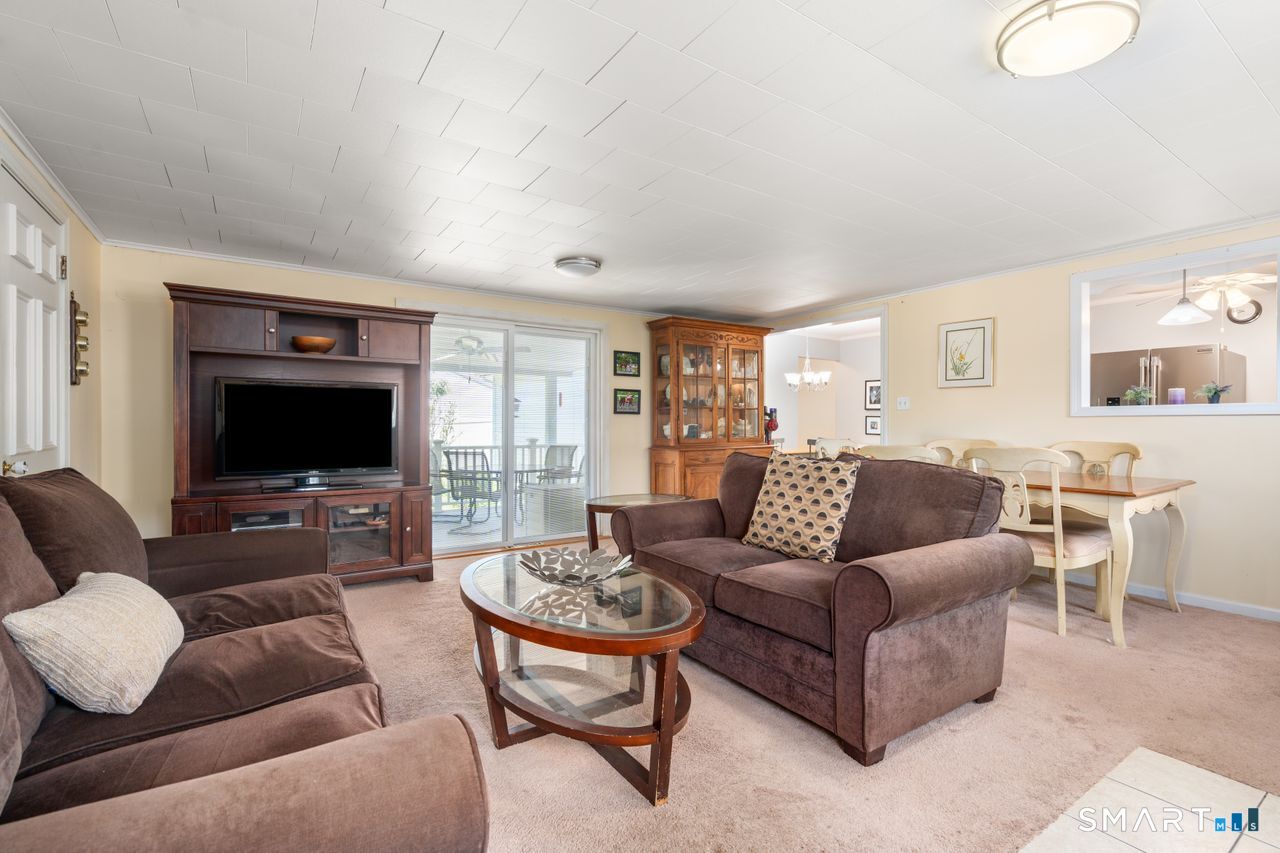 9 Stanton Road North Haven, CT 06473 - Photo 13 of 35 a living room with furniture and a flat screen tv