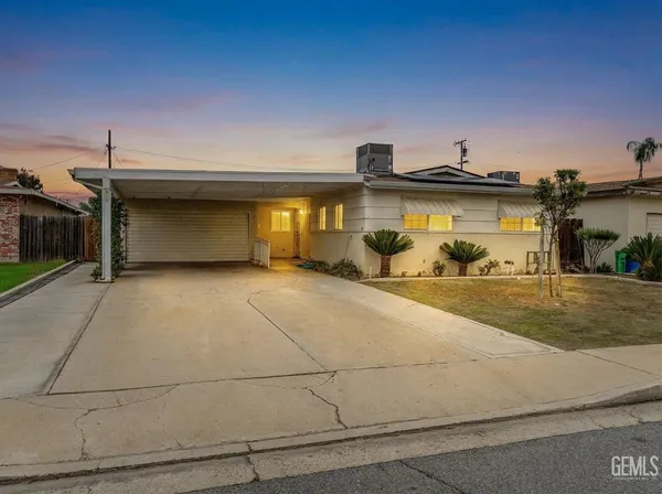 a view of a car parked front of a house