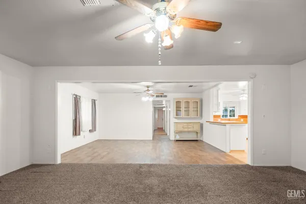 a view of a livingroom with furniture and chandelier