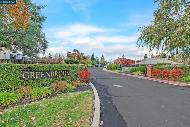 a view of a street with a sign broad
