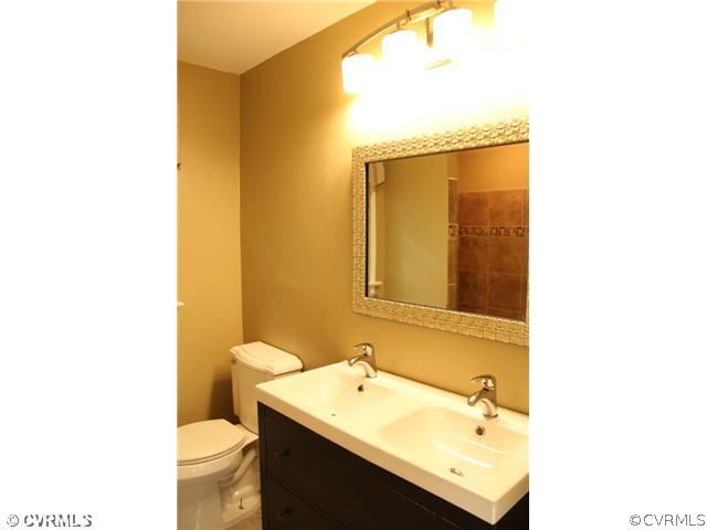 2406 Tanglebrook Road Midlothian, VA 23112 - Photo 13 of 24 a bathroom with a sink and a mirror