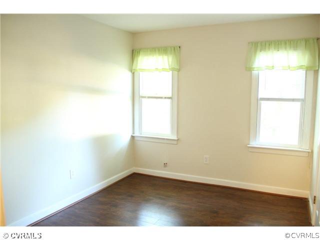 2406 Tanglebrook Road Midlothian, VA 23112 - Photo 16 of 24 an empty room with wooden floor and a window