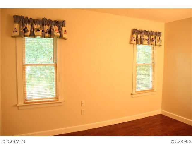 2406 Tanglebrook Road Midlothian, VA 23112 - Photo 17 of 24 a view of a big room with wooden floor and windows