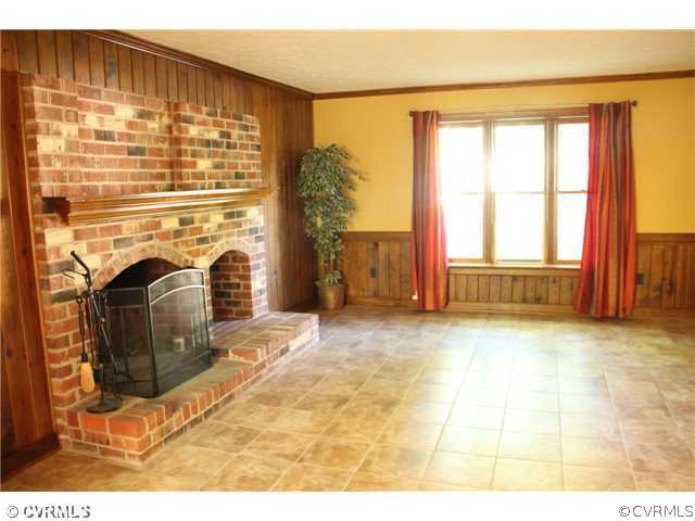 2406 Tanglebrook Road Midlothian, VA 23112 - Photo 4 of 24 a view of empty room with fireplace and fan