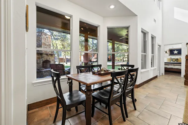 a view of a dining room with furniture window and outside view