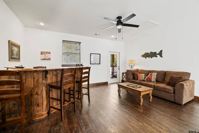a dining room with furniture and wooden floor
