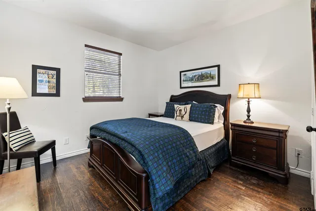 a view of a house with backyard sitting area and garden
