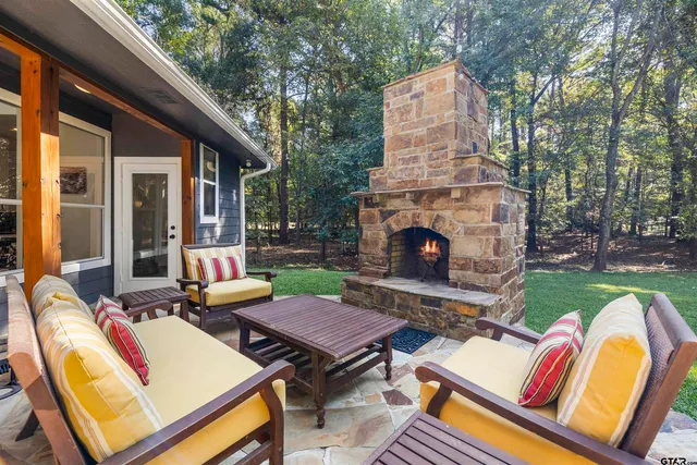 a backyard of a house with outdoor seating
