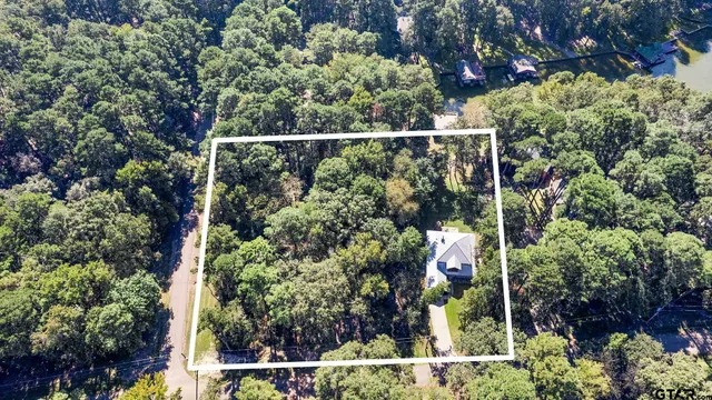 a view of balcony with wooden floor and outdoor seating