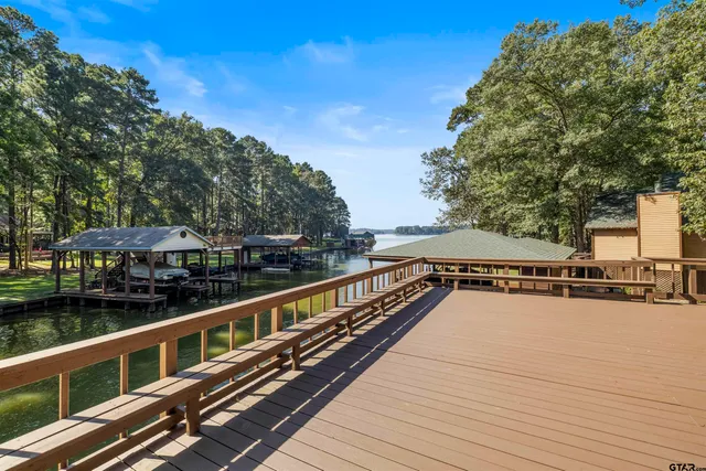 a front view of a house with garden and patio