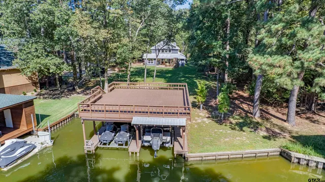 a view of swimming pool with a patio and a yard