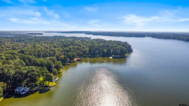 an outdoor space with pool and furniture