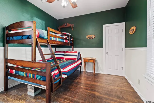 a bedroom with bunk bed and a dresser