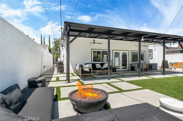 a view of a patio with table and chairs potted plants with wooden floor