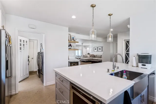 a large kitchen with a table and chairs