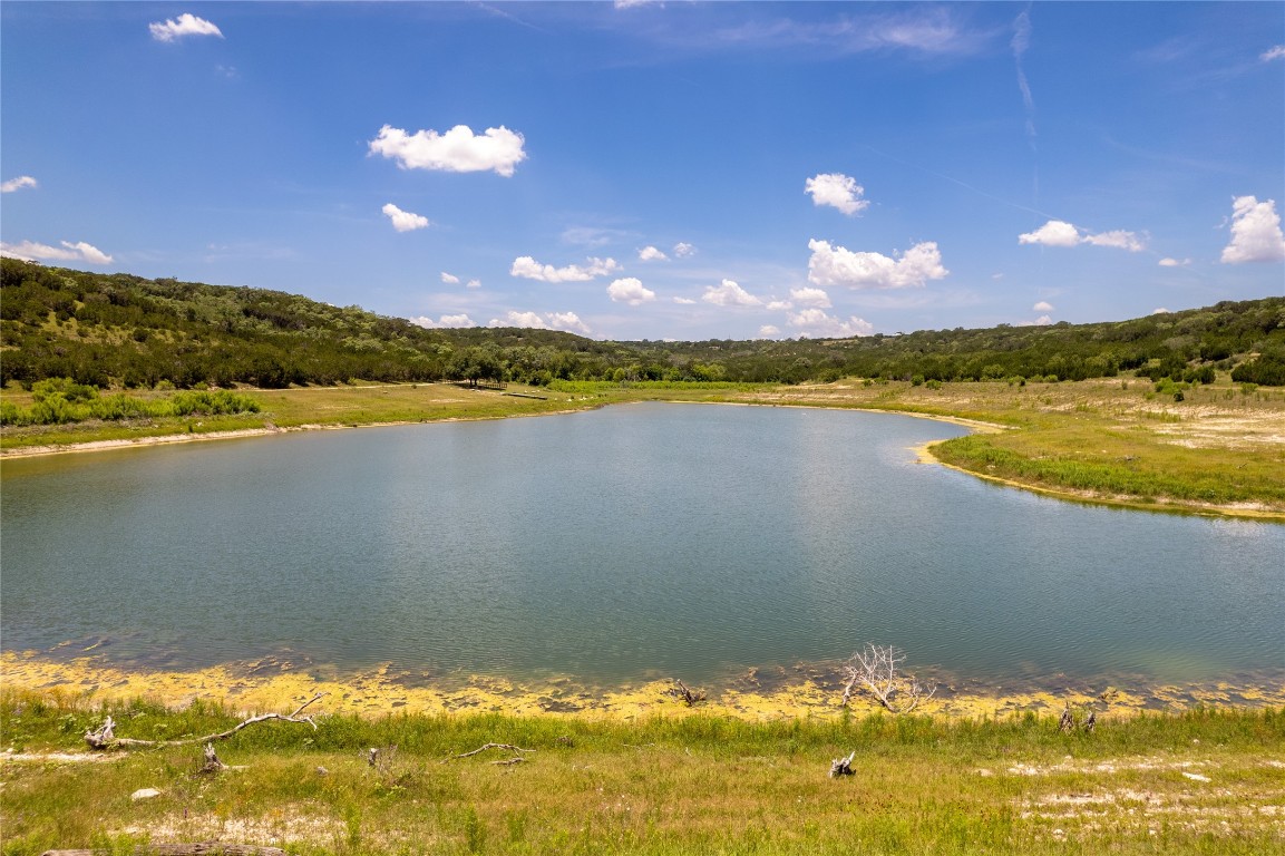 Lot 176 Suncrest Trail Bertram, TX 78605 - Photo 27 of 31 a view of a lake and sunset