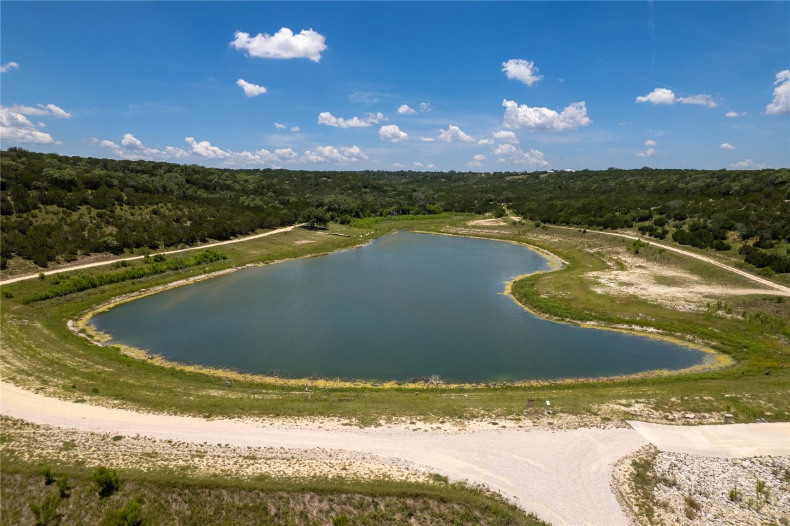 Lot 176 Suncrest Trail Bertram, TX 78605 - Photo 28 of 31 a view of a lake with a yard