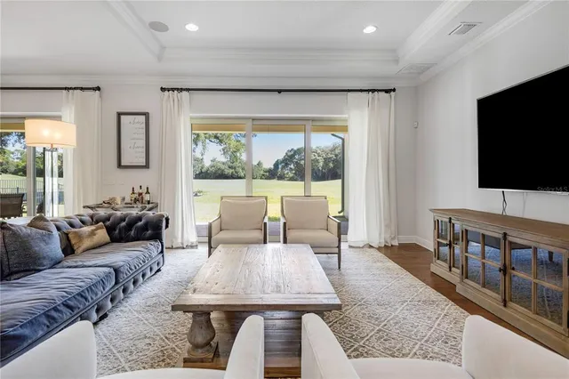 a large kitchen with kitchen island a sink a counter space and stainless steel appliances