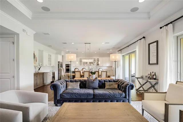 a kitchen with kitchen island granite countertop a sink a counter space stainless steel appliances and cabinets