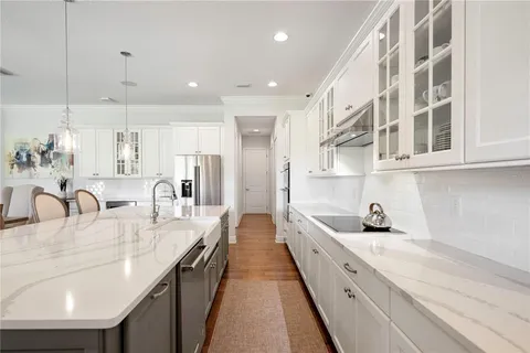 an aerial view of a house with swimming pool and outdoor seating