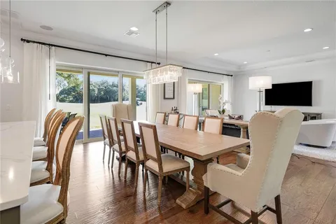 an aerial view of residential house with outdoor space and swimming pool