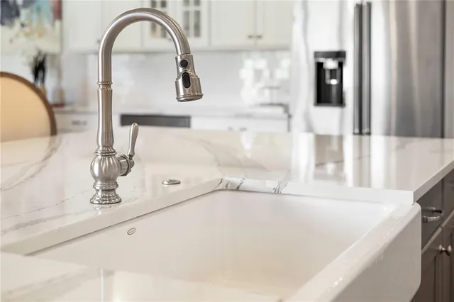 a spacious bedroom with a bed and glass door