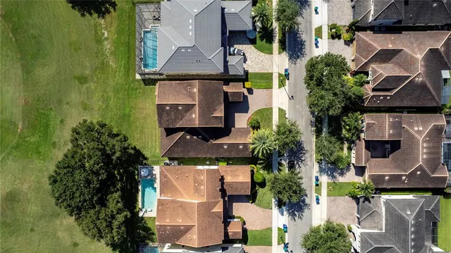 an aerial view of multiple houses with yard