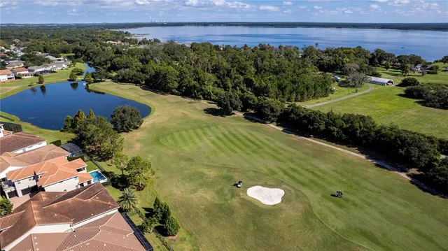 a view of wooden floor and windows in a room