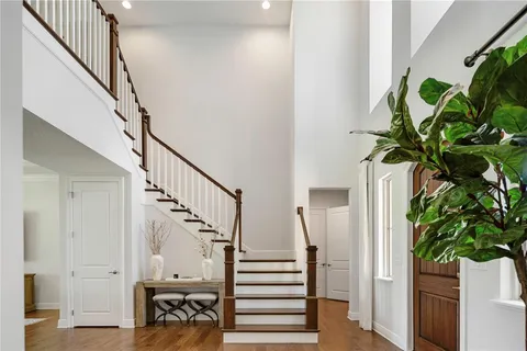 a view of a hallway with a wooden door