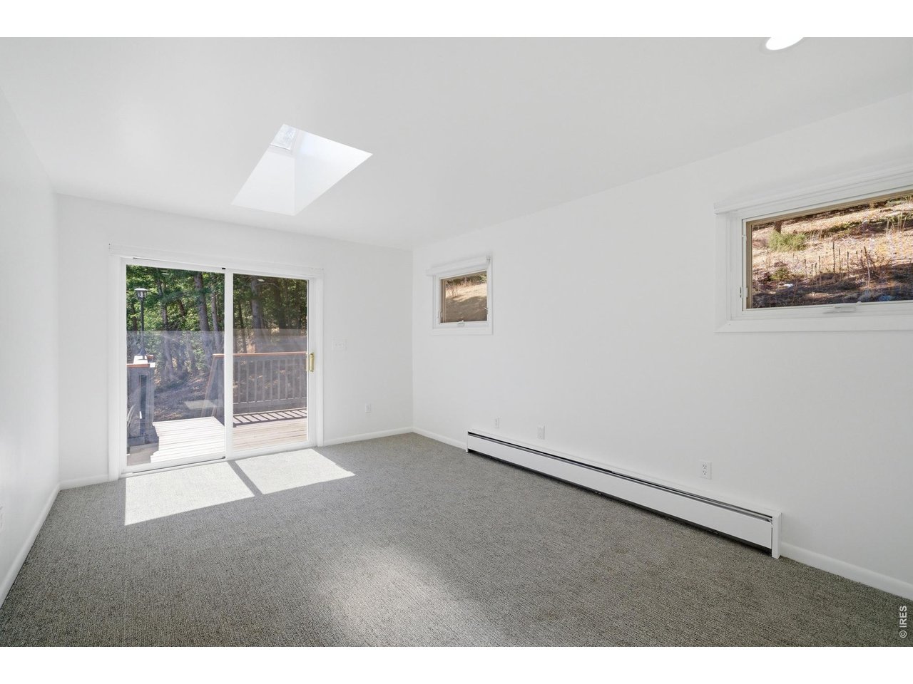910 Chute Road Golden, CO 80403 - Photo 20 of 33 Walkout to the wraparound deck from the Primary Bedroom