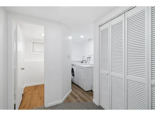 a utility room with closet dryer and washer