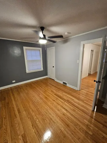 a view of a room with wooden floor and staircase