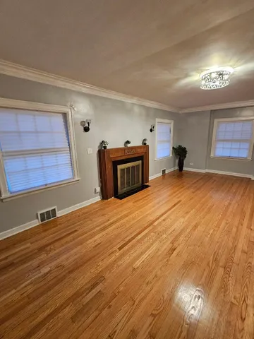 a room with a bed and a dresser