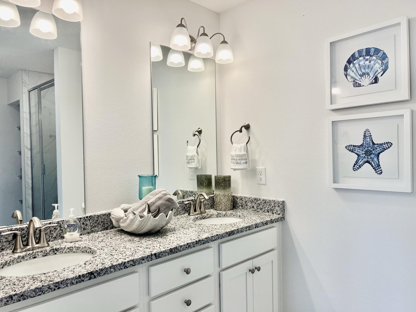 101 Phoenix Street Santa Rosa Beach, FL 32459 - Photo 10 of 13 a bathroom with double vanity sinks granite vanity and a mirror