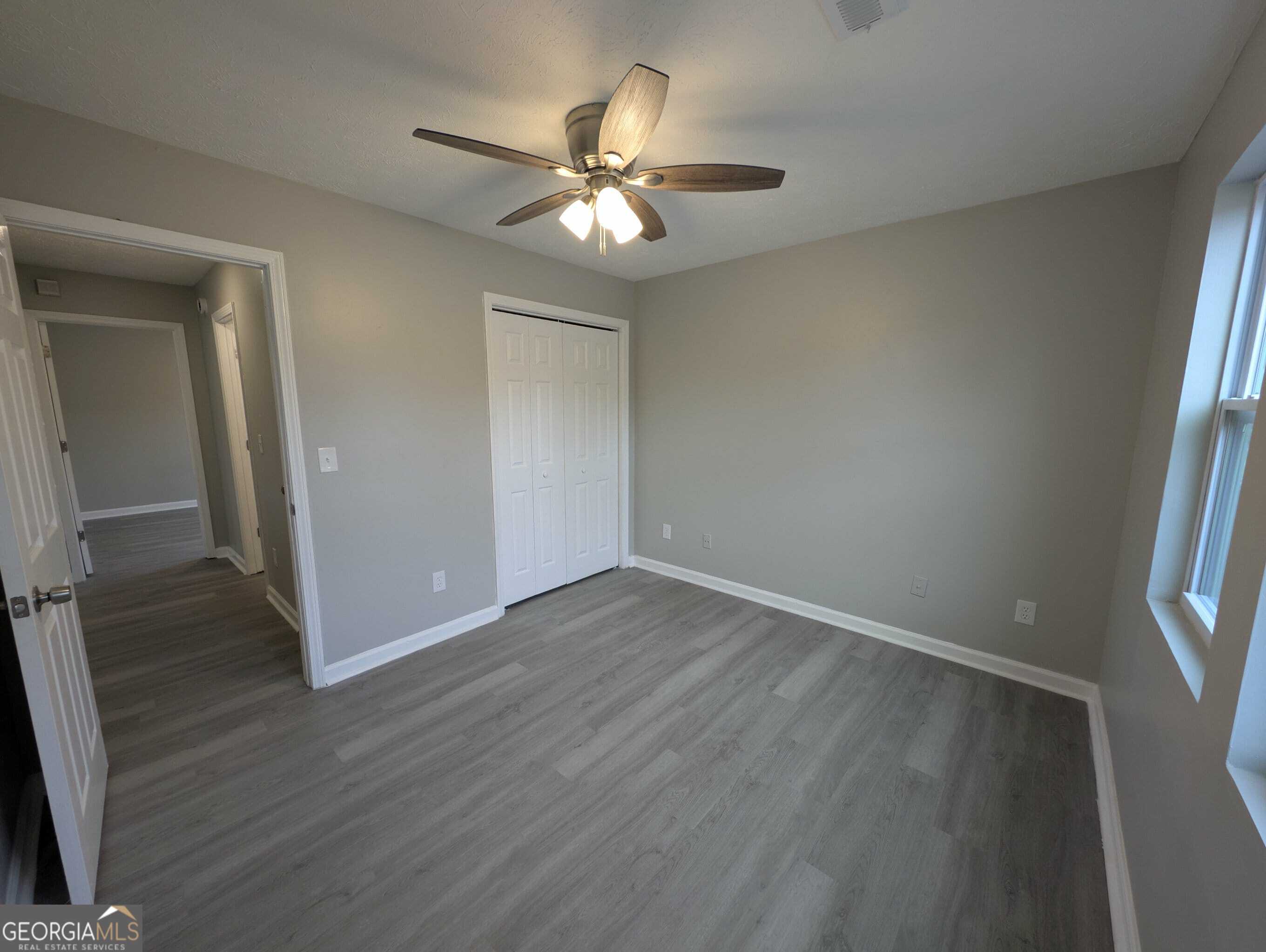 128 Crystal Brook Griffin, GA 30223 - Photo 20 of 25 wooden floor in an empty room with a window