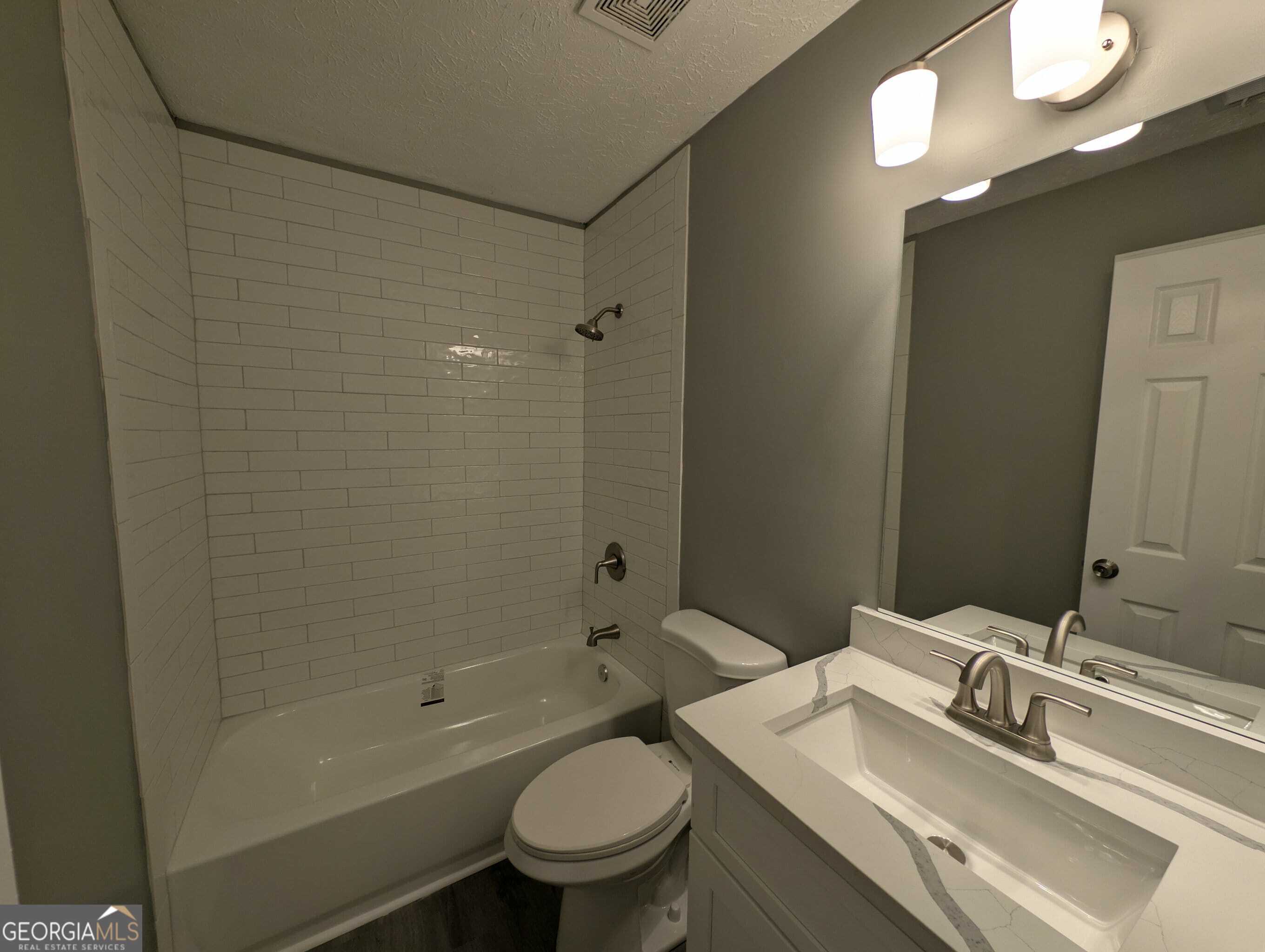 128 Crystal Brook Griffin, GA 30223 - Photo 21 of 25 a bathroom with a sink a toilet and shower