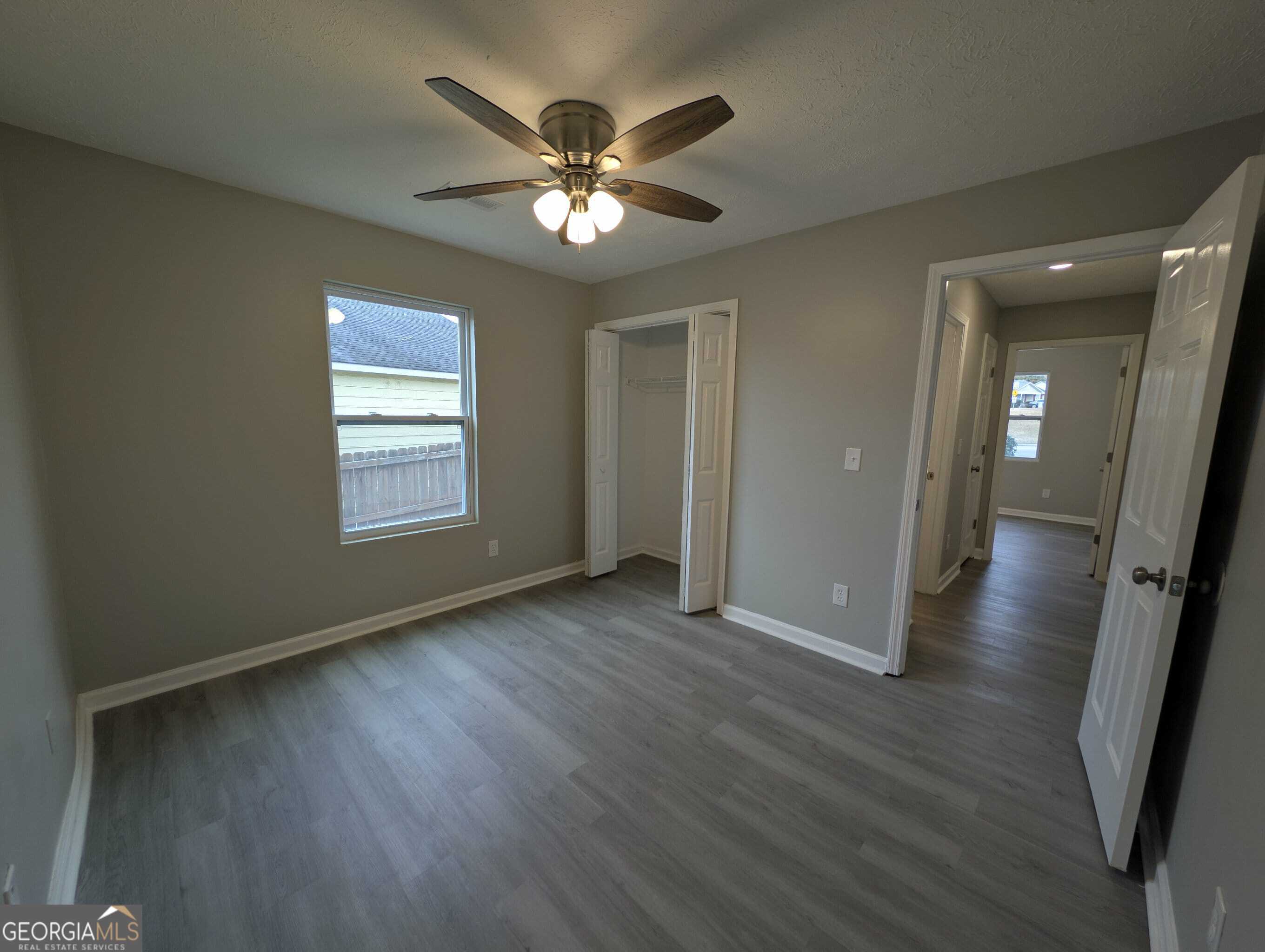 128 Crystal Brook Griffin, GA 30223 - Photo 25 of 25 a view of an empty room with wooden floor and a window