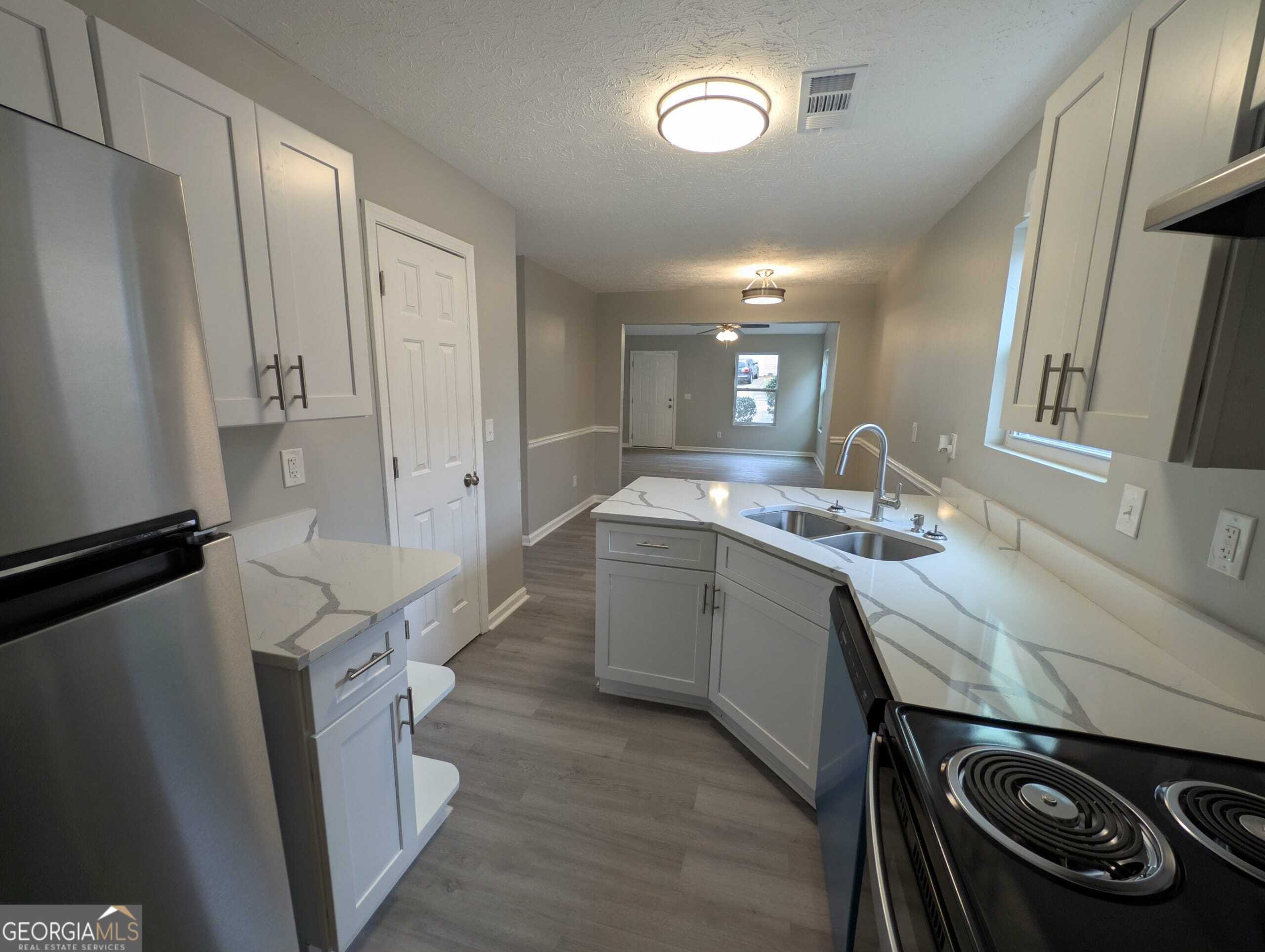 128 Crystal Brook Griffin, GA 30223 - Photo 8 of 25 a room with a sink a washer and dryer