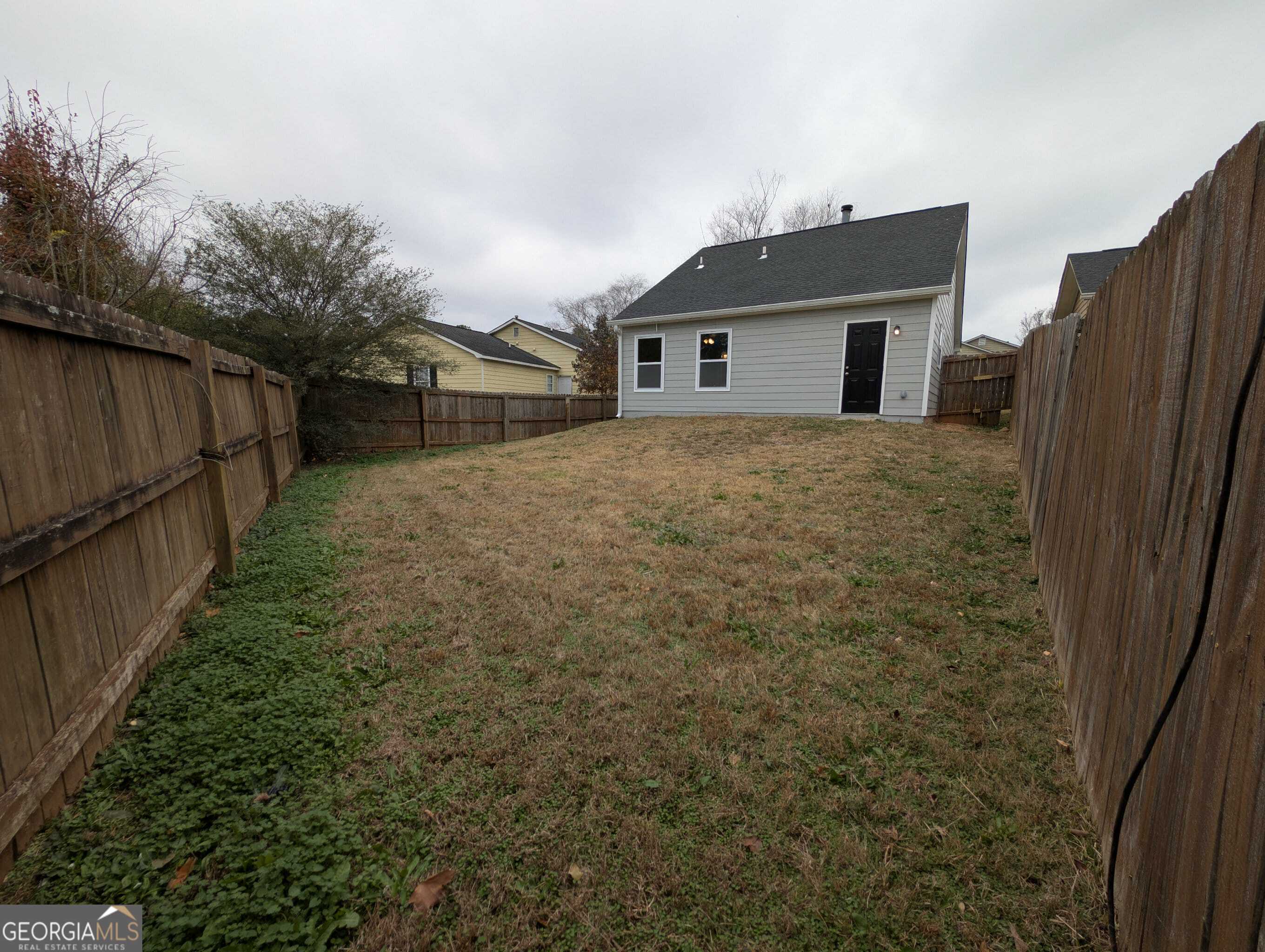 128 Crystal Brook Griffin, GA 30223 - Photo 10 of 25 a view of a house with a yard