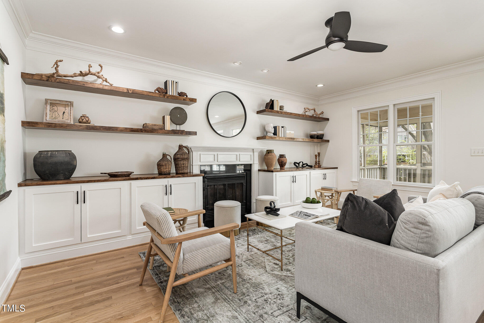 612 New Road Raleigh, NC 27608 - Photo 2 of 12 a living room with furniture cabinets and window