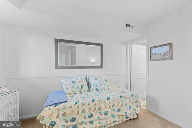 a bedroom with a bed and a cabinets