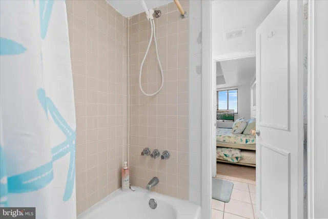 a bath room with a sink and a bath tub