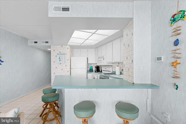 a kitchen with a stove and cabinets