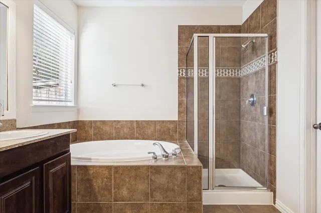 a bathroom with a bathtub and a shower