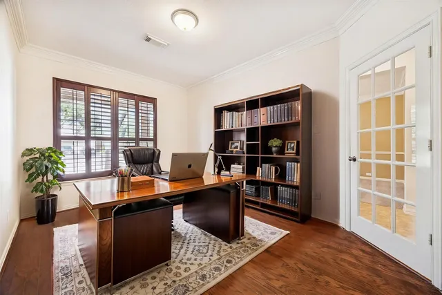 a work room with furniture and book shelf